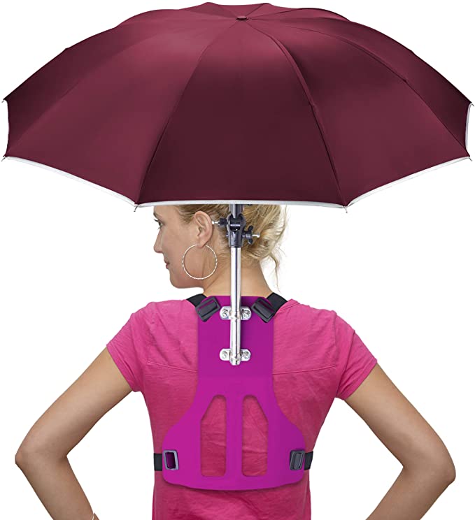 Woman wearing the Primo Supply Wearable Hands-Free Umbrella strapped to her back