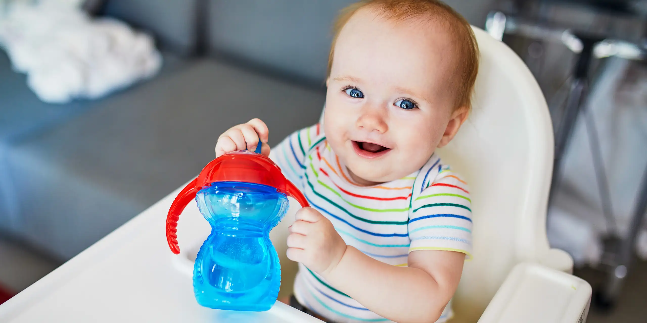 https://www.familyvacationcritic.com/wp-content/webp-express/webp-images/doc-root/wp-content/uploads/sites/19/2020/03/toddler-sippy-cup-high-chair.jpg.webp